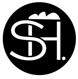 Logo_SH_schwarz_mit_weiß_Rand